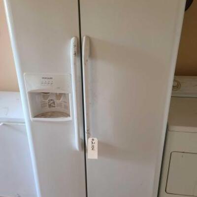 2104	

Frigidaire Refrigerator
Measures Approx: 36" x 31.5" x 69"