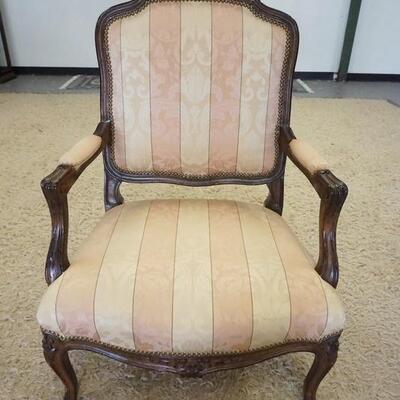 1010	FRENCH PROVINCIAL CARVED UPHOLSTERED ARM CHAIR
