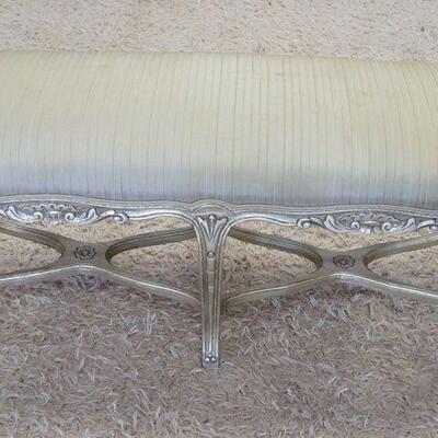 1011	UPHOLSTERED WINDOW BENCH W/GILT SILVER FINISH ON CARVED WOOD, SOME STAINING ON UPHOLSTERY, 43 1/2 IN X 16 IN X 19 IN HIGH
