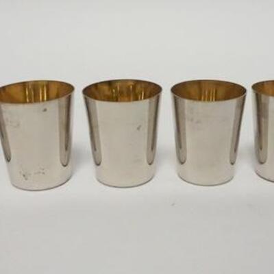 1064	NEST OF 6 SILVER PLATE GOLDWASH  SHOT GLASSES, GRADUATED, MADE IN GERMANY, 1 3/4 IN HIGH
