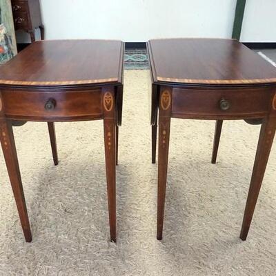 1003	PAIR OF OVAL MAHOGANY BANDED ONE DRAWER DROP LEAF TABLES W/ BELL FLOWER INLAY. 39 IN OPEN 18 1/2 IN W CLOSED, 28 IN  X 29 IN 
