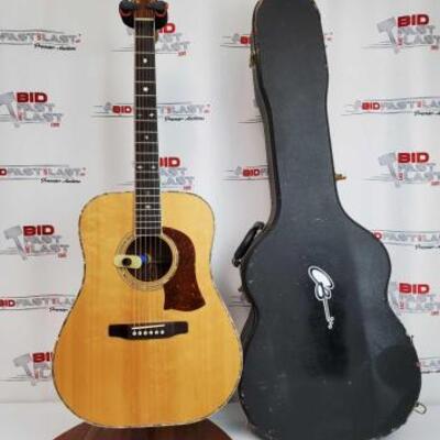 2028	

S.L. Mossman Winter Wheat Acoustic Guitar With Hard Case
Stand Not Included. No. 76-3700