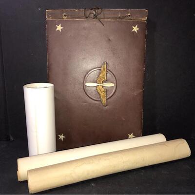 Very old military album with black and white pictures, a rolled up photo of Fort Bragg from 1942 and a black and white photo that is not...