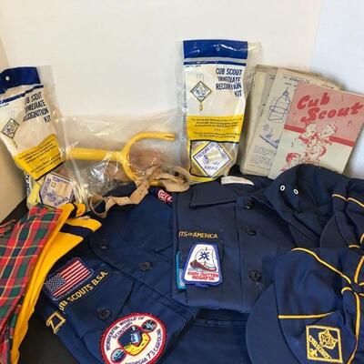 Boy Scout and 2 Cub Scout shirts, one pair of pants(patch work),  three hats, three kerchiefs, a vintage sling shot toy, 2 recognition...