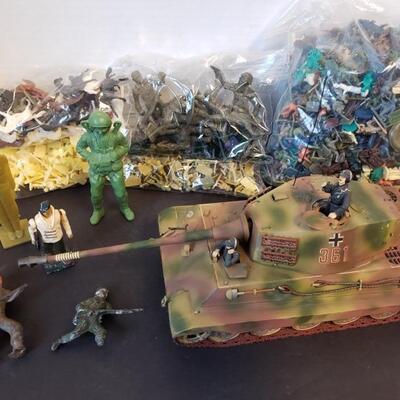 Includes plastic and metal Army men, horses and tank (measures 11"L x 4"H x 5"W)....