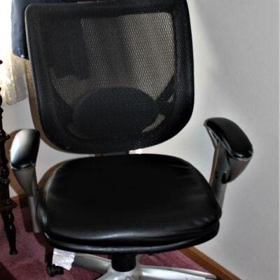Comfortable office chair with breathable mesh head rest and back.