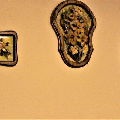 Three dimensional antique floral wall hangings.