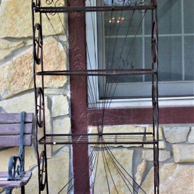 Large metal plant stand.