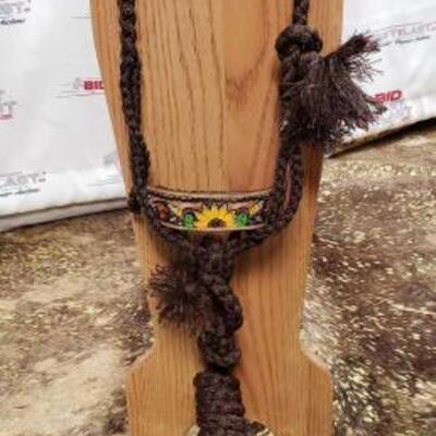 79	

ShowmanÂ® Woven brown nylon mule tape halter with hand painted feather, sunflower and cactus noseband
Showman Woven Brown Nylon Mule...