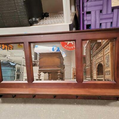 #2903 â€¢ 3 Panel Pub Mirror: Three Panel Pub Mirror with Ledge and Five Hooks Made with Solid Wood and Dark Walnut Finish Measures...