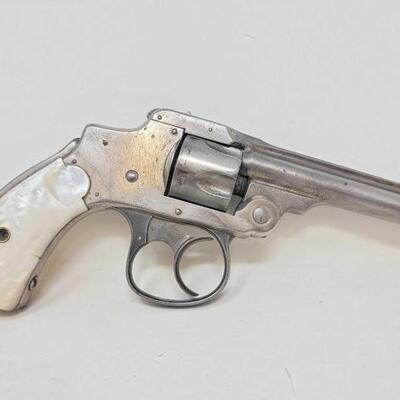 #326 â€¢ Smith & Wesson Safety Hammerless .32 Revolver. Serial Number: 57868 Barrel Length: 3.5" Mother of Pearl Handle. 