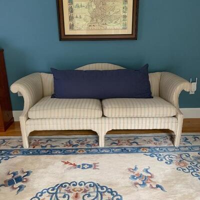 Cream Camelback Sofa and Wool Rug