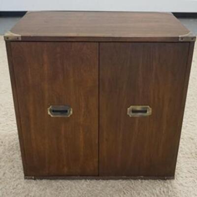 1192	2 DOOR CABINET W/ BRASS HARDWARE. 30 1/4 IN W, 30 IN H, 19 IN DEEP. HAS AN INTERIOR SHELF 
