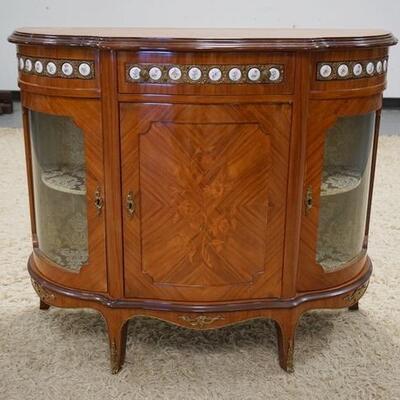 1174	INLAID DEMILUNE 3 DOOR CABINET, HAS 2 SIDE CURVED GLASS DOORS & CENTER BLIND DOOR, BRASS DECORATION W/INSET PORCELAIN...