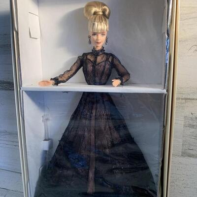 NIB Nolan Miller Cotoure Sheer Illusion Barbie
First in a Series
