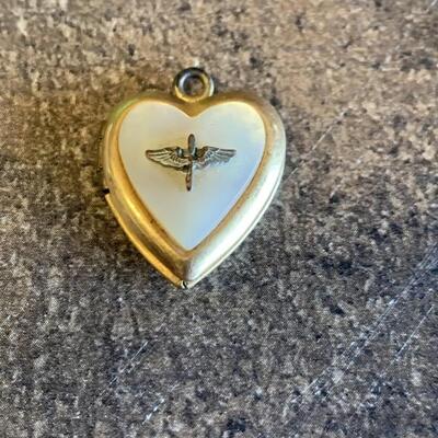 Locket is Mother of Pearl and Costume Gold