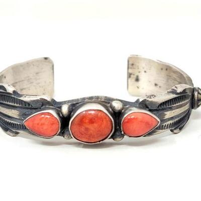 #622 â€¢ Native American Sterling Silver Coral Engraved Cuff: Beautiful sterling silver cuff has 3 accent coral stones.
Weighs Approx...