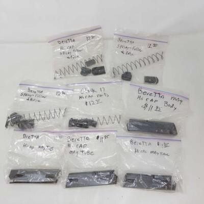 #1858 â€¢ Gun Parts ncludes (3) Beretta Hi Cap Spring Foller and Base, Glock 17 Hi Cap Parts, Beretta Hi Cap Mag Tub, (2) Beretta Hi Cap...
