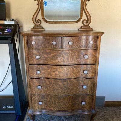 Tall serpentine oak dresser