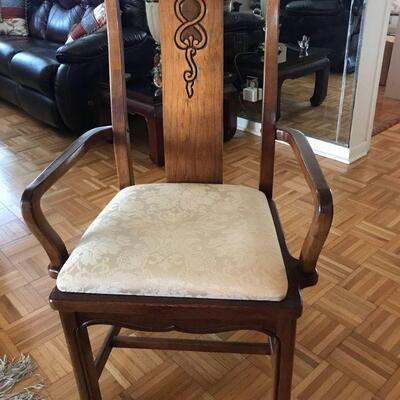 Thomasville dining chairs. These chairs are oak and have a carved splat with routed trim. The legs are straight with an implied reverse...
