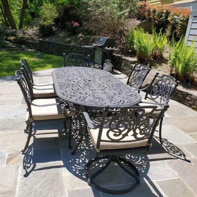 cast metal table, 8 chairs