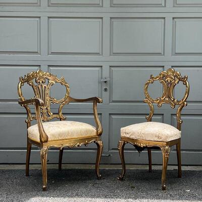 PAIR GILT CHAIRS | Fancy accent chairs, including an armchair (37 x 25 x 26 in.) and a side chair, each with highly carved backrests with...