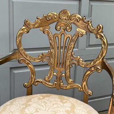 PAIR GILT CHAIRS | Fancy accent chairs, including an armchair (37 x 25 x 26 in.) and a side chair, each with highly carved backrests with...