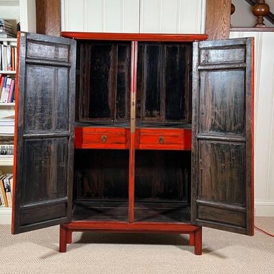 CHINESE LACQUERED CABINET | Red lacquered cabinet, with double doors opening to reveal two drawers between open shelves, with brass...