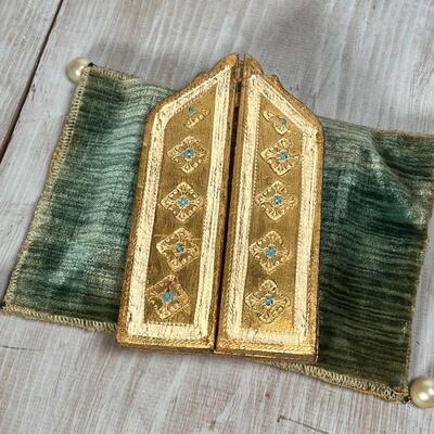 MINIATURE SHRINE | Shrine in three panels, showing a portrait of a young woman in prayer, gilt and paint decorated with a green velvet...