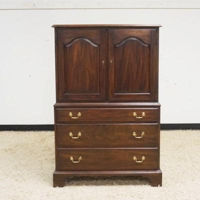 1005	HENKEL HARRIS VIRGINIA GALLERIES MAHOGANY HIGH CHEST W/DOUBLE DOOR OVER 3 DRAWERS, APPROXIMATELY 57 IN X 21 IN X 56 IN HIGH
