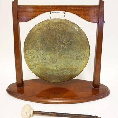 1094	ASIAN ENGRAVED BRASS GONG ON WOOD STAND, APPROXIMATELY 8 IN X 20 IN X 18 IN HIGH
