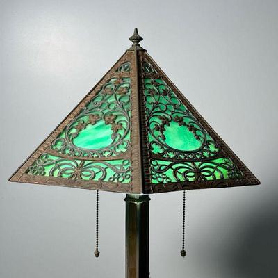 SLAG GLASS DESK LAMP  |  Having six panels with pressed tin overlay on an iron and brass base - l. 16 x w. 14 x h. 21 in.