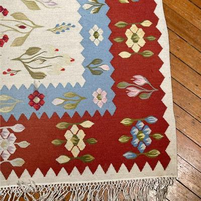 FLAT WOVEN RUG  |  Romanian, 20th century, flat woven geometric rug with branches on a taupe ground within blue and red borders of...