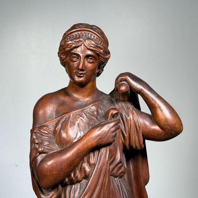 COMPOSITION FIGURE  |  Bronze style composition figure of a woman donning a robe - h. 21 1/4 in.