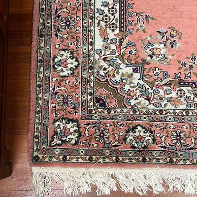 MEDALLION AREA RUG  |  Having a central medallion on a salmon ground with floral arabesque borders - l. 6.75 x w. 4.25 ft. (approx)