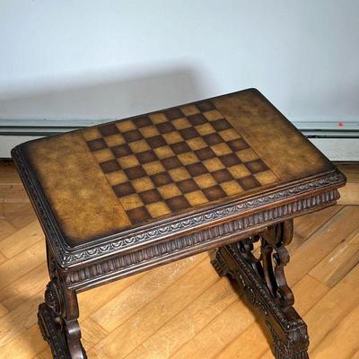 FANCY GAMES TABLE  |  Ornately carved wooden games table with chessboard top - l. 28 x w. 18.5 x h. 31 in.