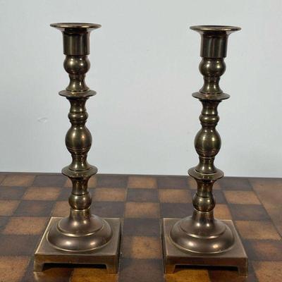 (2pc) PAIR BRASS CANDLESTICKS  |  With square bases, appearing in good condition - h. 9 1/2 in.