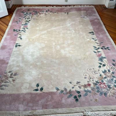 CHINESE WOOL RUG  |  Nichols-style rug, having a beige ground with scrolling floral sprays and a light pink border - l. 11.5 x w. 8.3 ft....