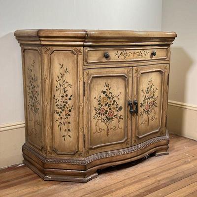 VENETIAN PAINTED CABINET  |  Side cabinet with a shaped front and top, with overall floral and viney decoration, hand painted - l. 41.5 x...