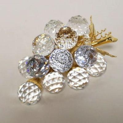 1011	SWAROVSKI CUT CRYSTAL GRAPE CLUSTER ON GILT METAL VINE, APPROXIMATELY 5 IN X 2 IN H
