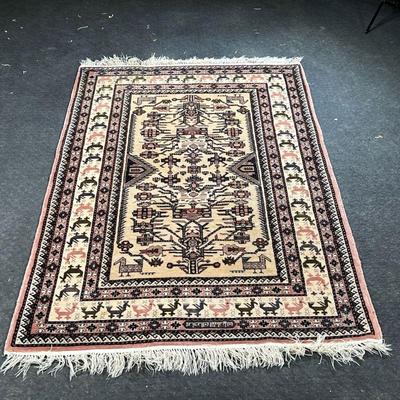 ROYAL UZBEK WOOL RUG  |  
Retailed by RH Macy & Co, having a geometric pattern with vines flowers and animals on a cream filled and...
