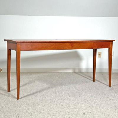 THOMAS MOSER SIDE TABLE  |
C. 1990, solid wood, with confirming glass top, signed by maker and dated on underside - l. 60 x w. 18 x h. 28...