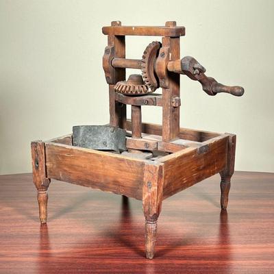 EARLY MECHANICAL MANDOLIN SLICER  |
Having a pegged wooden frame, mounting carved wooden gears, driving a circular mandolin slicer...