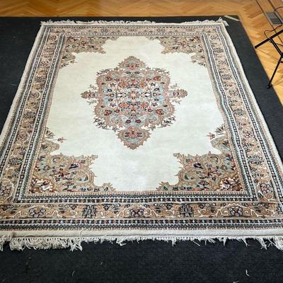 MEDALLION CARPET  |  
Hi pile with a central medallion on a cream ground, with scrolls in blue and teal green - l. 106 x w. 69 in.
