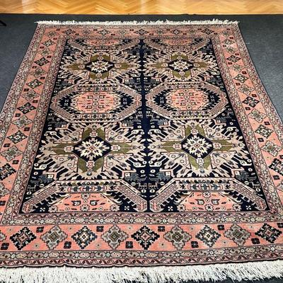 GEOMETRIC CARPET  |  
Having six medallions on a blue field in a salmon border with cross devices - l. 117 x w. 78 in.