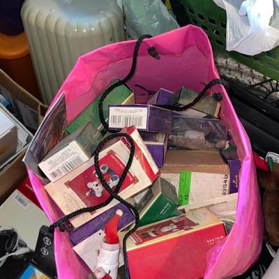 Bags full of individually boxed Christmas ornaments 