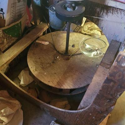 Here is the pottery wheel, it has an electric motor to turn the wheel