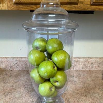 glass container with green apples