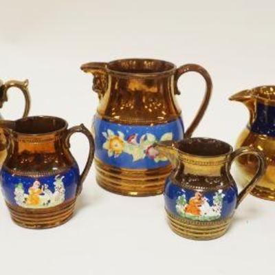 1092	ANTIQUE COPPER LUSTER PITCHERS GROUP OF 9, LARGEST APPROXIMATELY 6 IN HIGH
