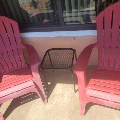 Pair of plastic Adirondack chairs